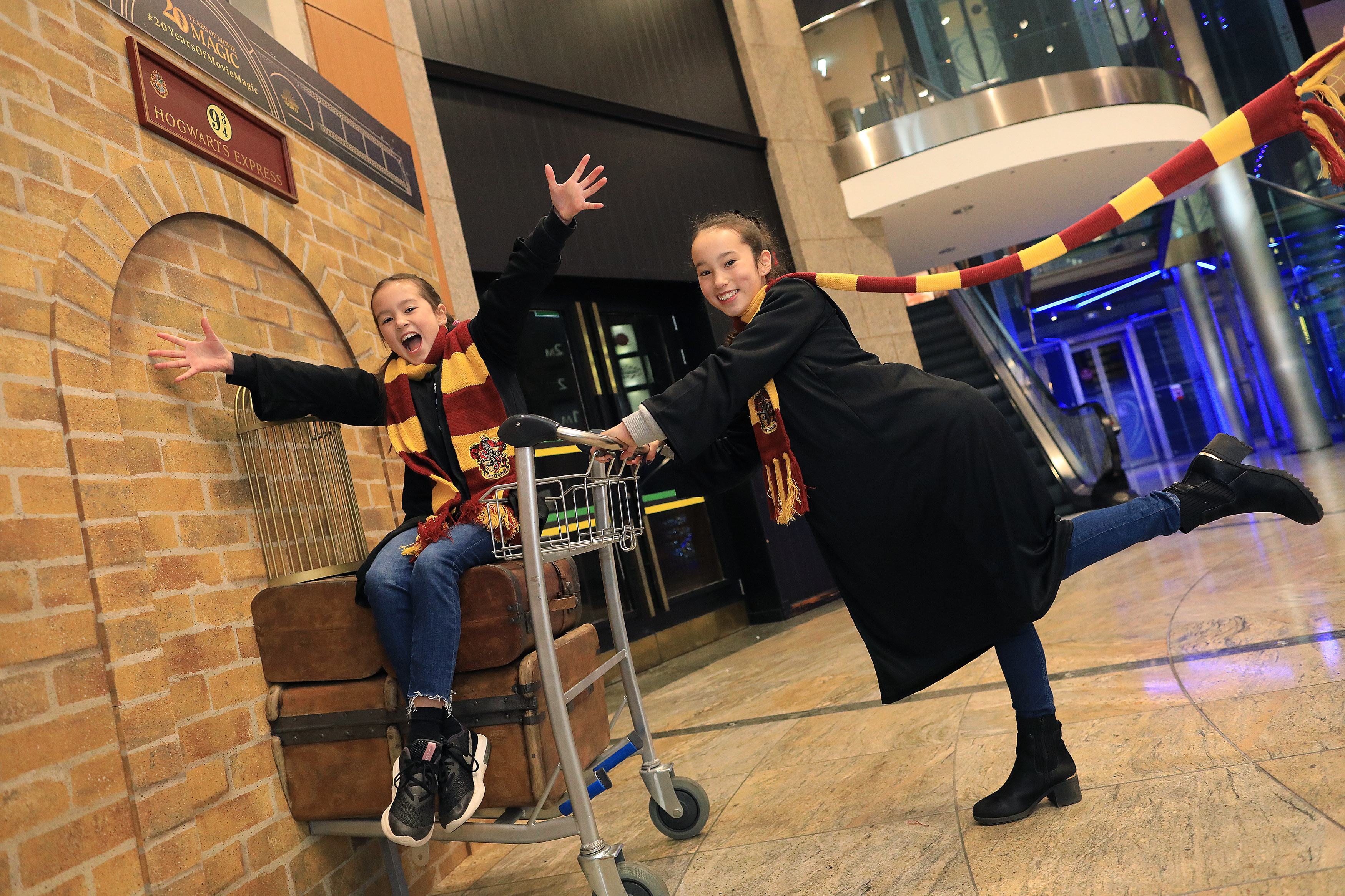 Maya and Lia Sheils (10/11 yrs) pose with the Harry Potter Platform 9 ¾ trolley that was unveiled today in Dundrum Town Centre, Dublin. The trolley has been touring the UK and Ireland, to celebrate the 20th anniversary of Harry Potter and the Philosophers Stone release in UK and Irish cinemas, with the film returning to cinemas for special screenings, including Movies @ Dundrum showing all eight installments this weekend .