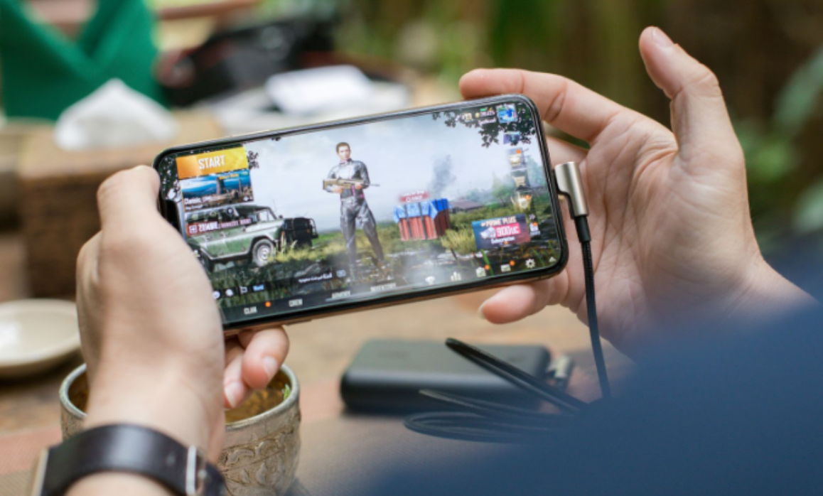person playing PUBG on mobile phone